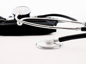 Stethoscope and Blood Pressure Monitor on White Background
