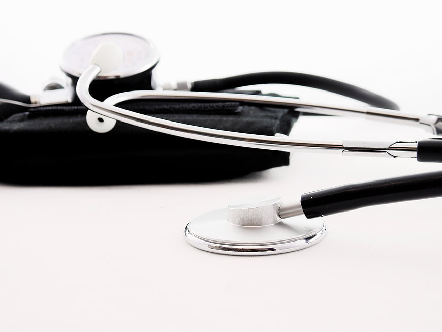 Stethoscope and Blood Pressure Monitor on White Background