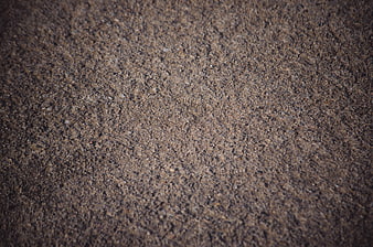 Close-up texture of dry cracked earth and gravel ground surface