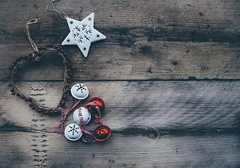 Rustic Christmas ornaments on wooden background with copy space