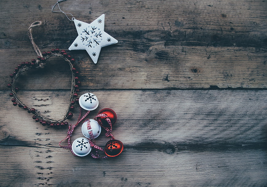 Rustic Christmas ornaments on wooden background with copy space