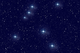 Deep blue starry night sky with bright starburst effects