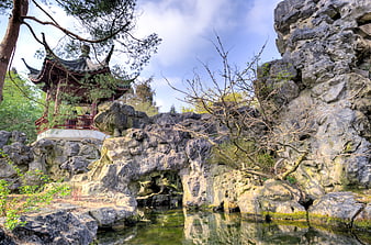 Traditional Chinese Pavilion in Classical Garden with Rockery