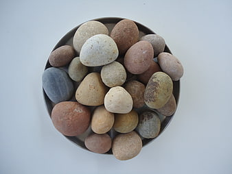 Top View of Smooth River Stones in a Bowl