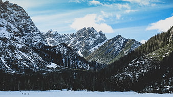 Snowy Mountain Peaks and Frozen Lake Landscape