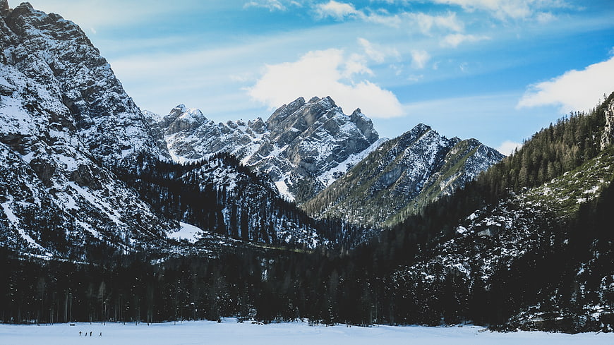 Snowy Mountain Peaks and Frozen Lake Landscape