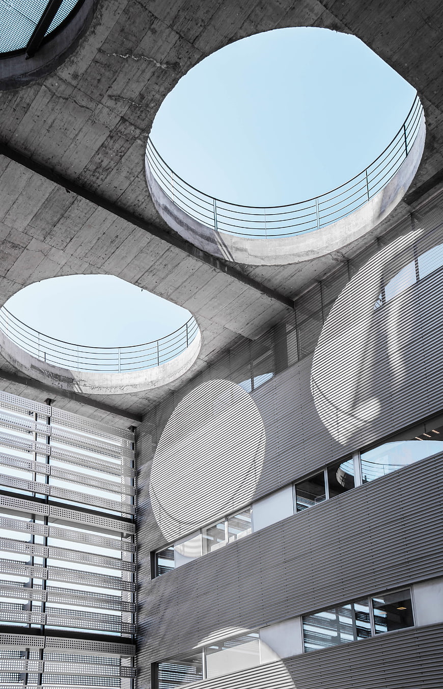 Modern concrete architecture with circular skylights and shadows