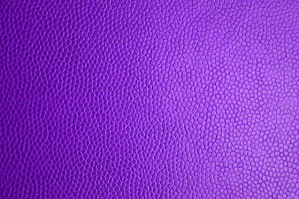 Purple textured surface background with pebbled pattern