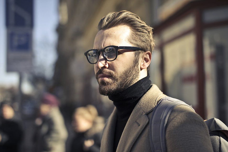 Stylish Bearded Man with Glasses on City Street