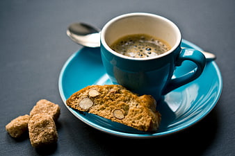 Blue Coffee Cup with Almond Biscotti and Brown Sugar