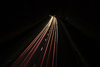 Long Exposure Light Trails on a Dark Highway at Night