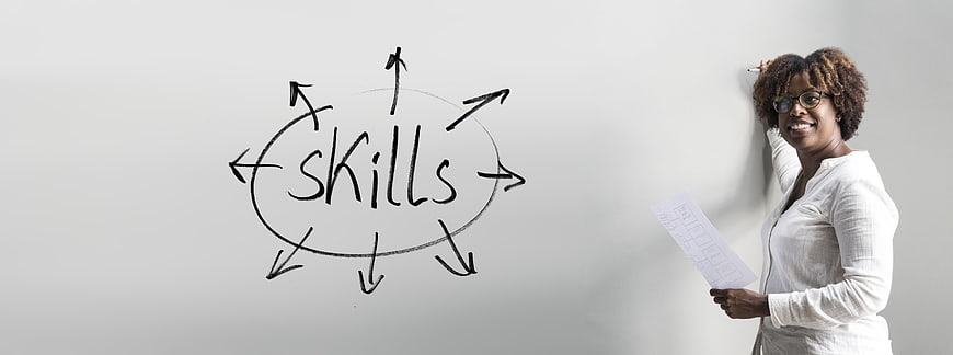 Businesswoman presenting skills concept on whiteboard