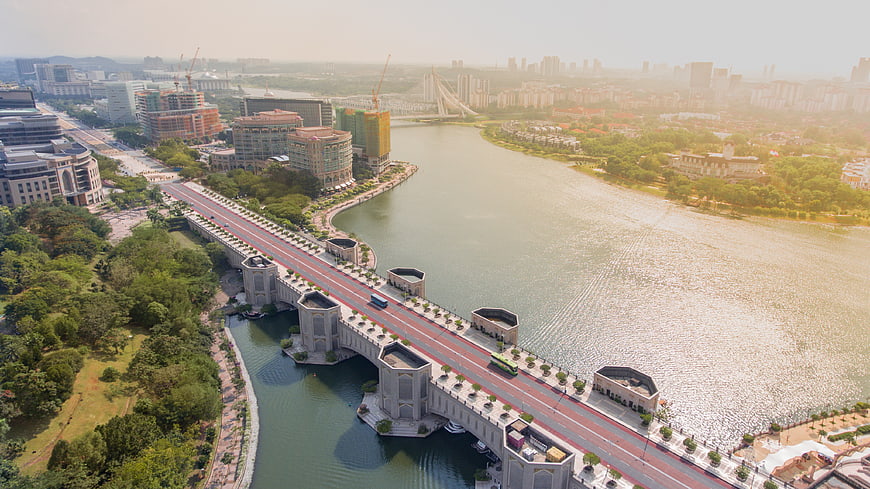 Aerial View of Modern Bridge Over River in Urban Cityscape