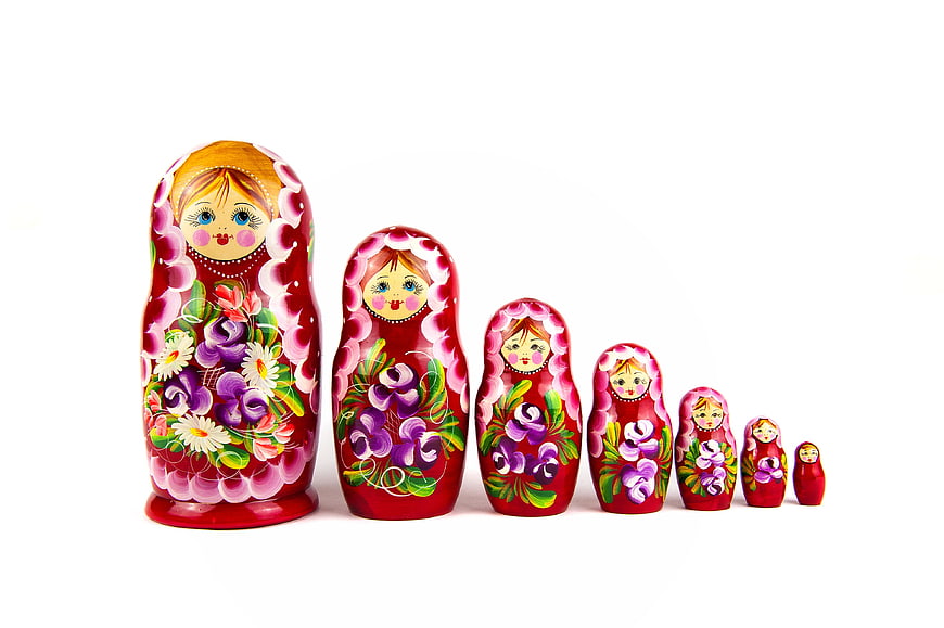 Colorful Russian Matryoshka Nesting Dolls on White Background