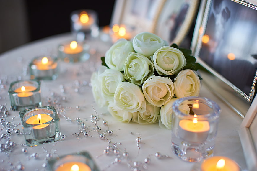 White Rose Bouquet with Candles and Silver Decor