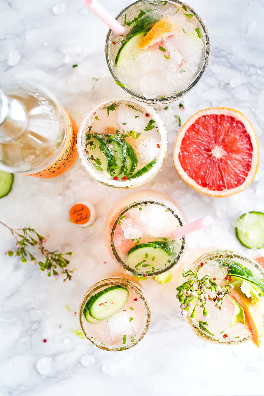 Overhead view of refreshing grapefruit cucumber cocktails on ice