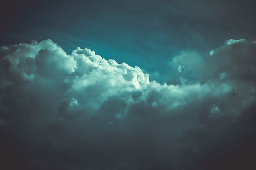 Dramatic Dark Storm Clouds With Teal Sky