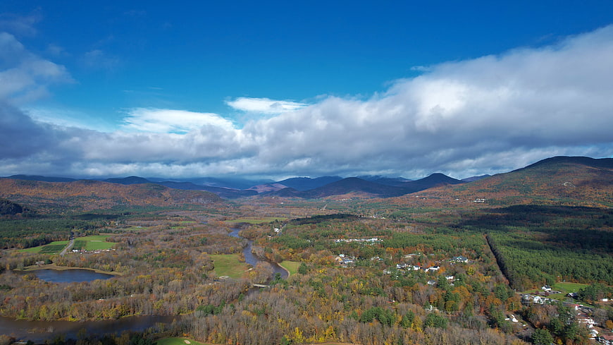 Aerial View of Autumn Valley with Mountains and River
