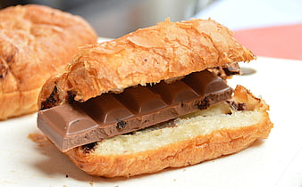Close-up of Pain au Chocolat with Flaky Pastry and Chocolate Bar