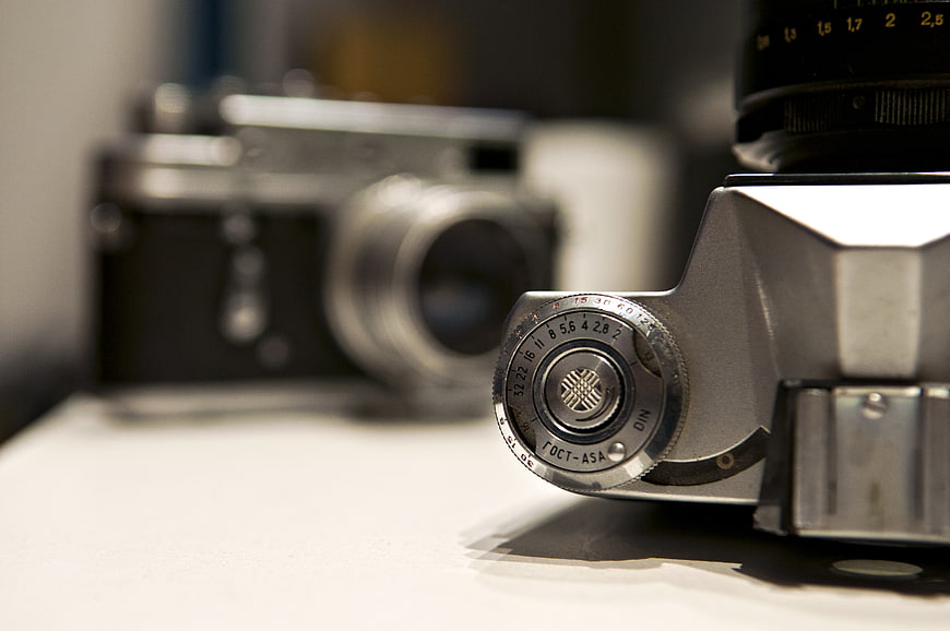 Close-up of vintage film camera ISO dial and lens