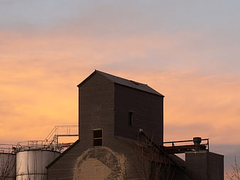 Industrial Silhouette Against Vibrant Sunset Sky