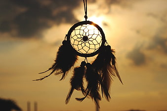 Dreamcatcher Silhouette Against Golden Sunset Sky