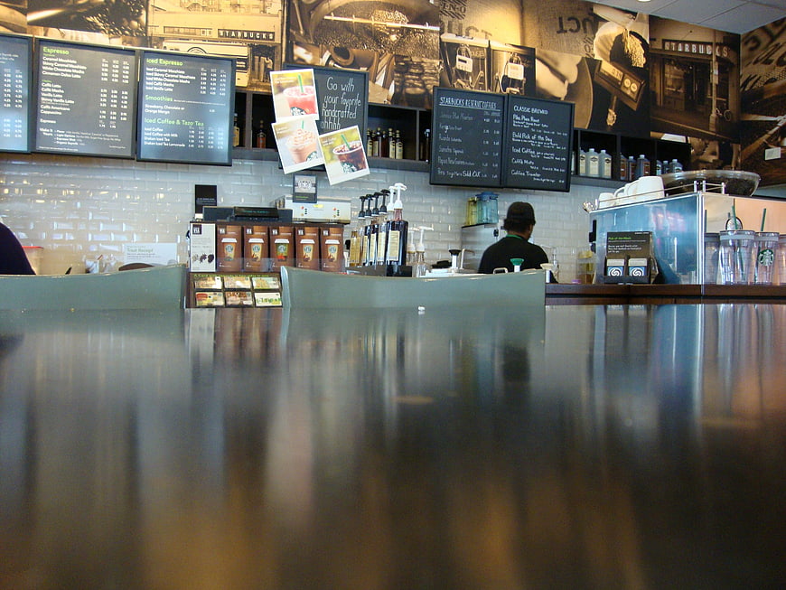 Low angle view of Starbucks coffee shop counter and menu