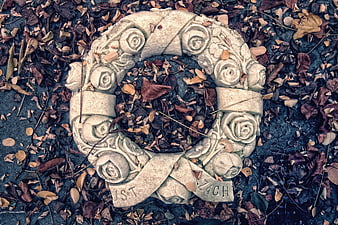 Stone Rose Wreath on Fallen Autumn Leaves