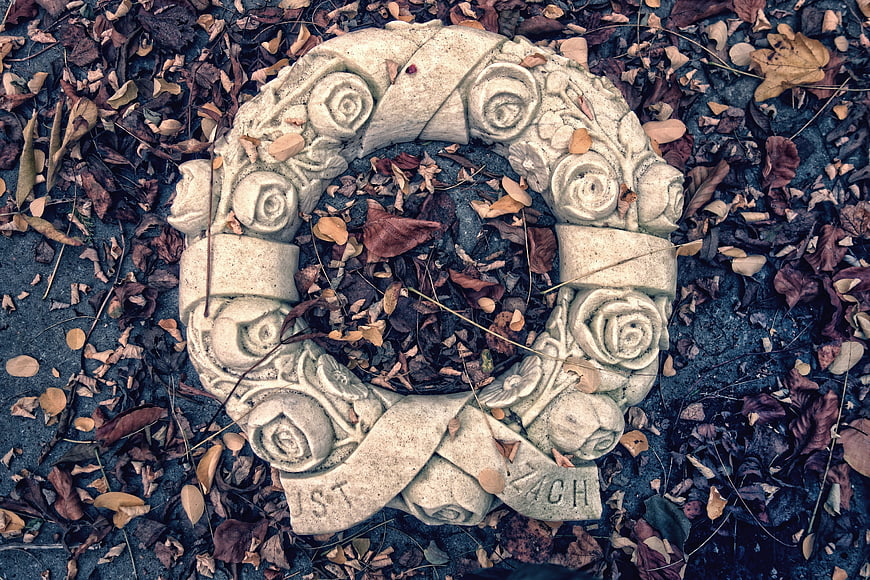 Stone Rose Wreath on Fallen Autumn Leaves
