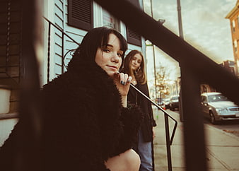 Two Young Women on Urban Street Steps