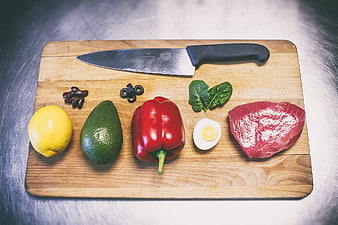 Fresh healthy meal ingredients on wooden cutting board