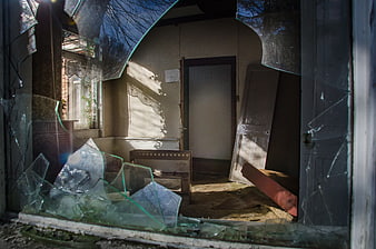 Broken Window Looking Into Abandoned House Interior