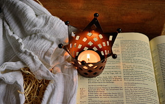 Advent Crown Candle on Open Bible with Straw and Cloth
