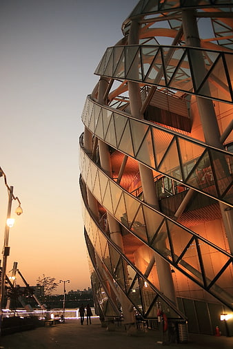Modern Twisted Glass Architecture at Sunset