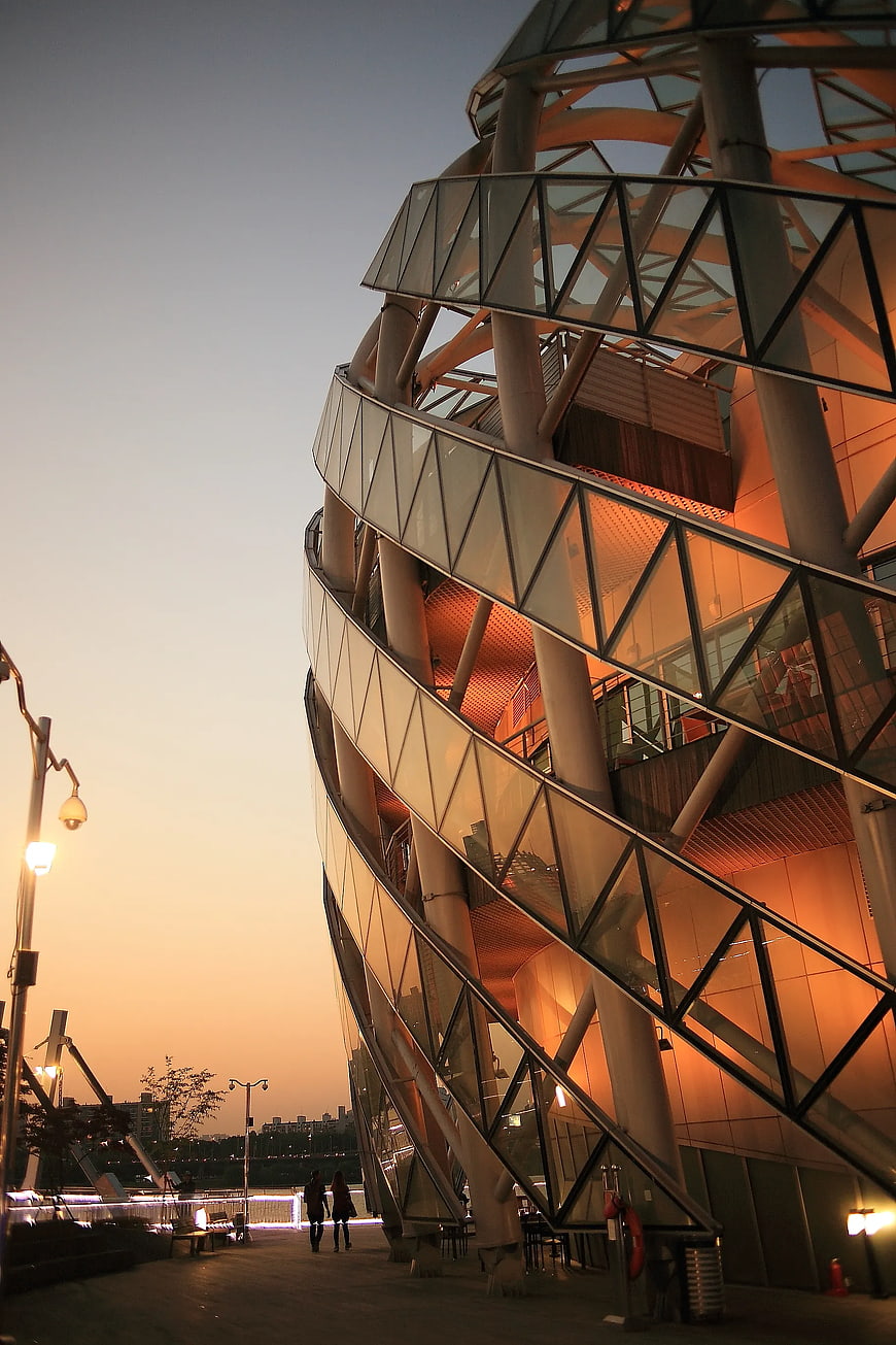 Modern Twisted Glass Architecture at Sunset