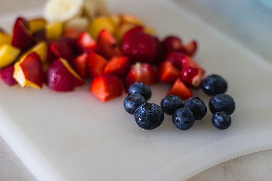 Fresh Mixed Fruit Salad on White Cutting Board