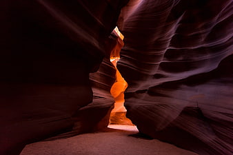 Antelope Canyon Slot Rock Formation With Bright Orange Light Beam