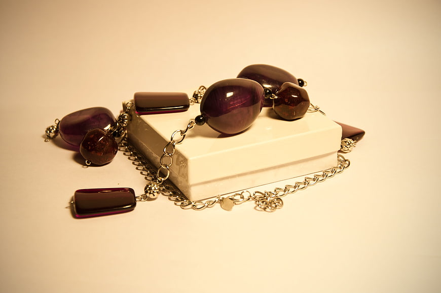 Purple Beaded Jewelry on White Box