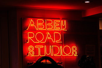 Red Abbey Road Studios Neon Sign in Dark Room