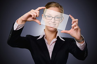 Businesswoman holding transparent screen mockup