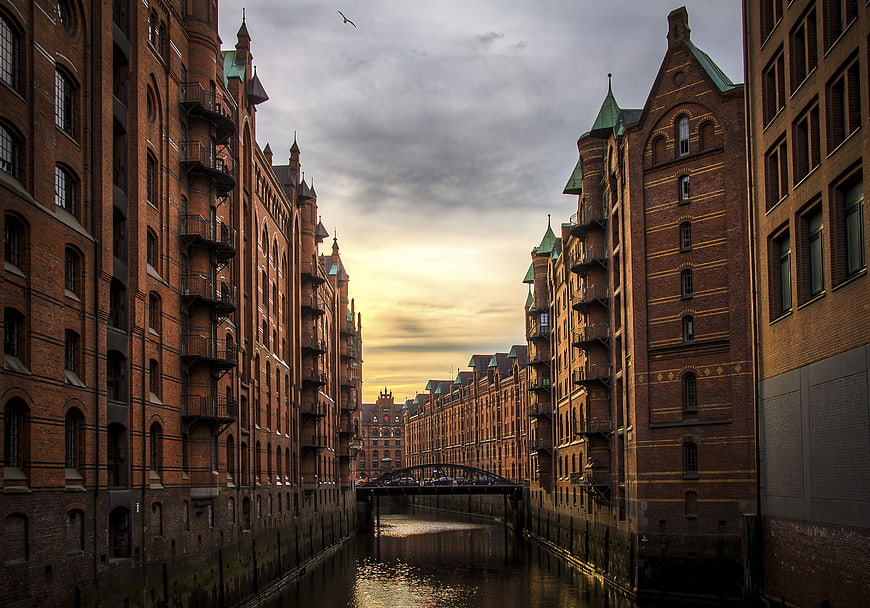 Historic Brick Warehouses Along Hamburg Canal at Sunset