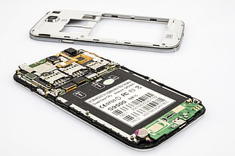 Disassembled Smartphone Internal Components and Back Cover