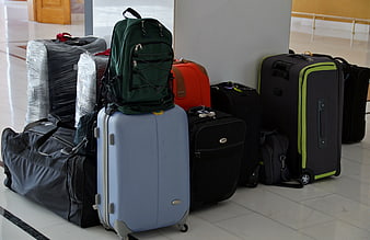 Collection of Travel Luggage and Suitcases in Airport Terminal