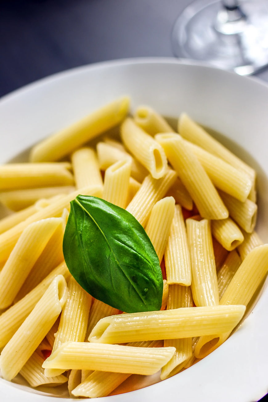 Close-up of Penne Pasta with Fresh Basil Leaf