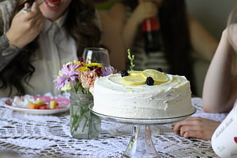 Homemade Lemon Cake with Blackberries on Lace Tablecloth