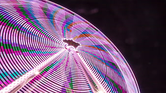 Colorful Ferris Wheel Light Trails at Night