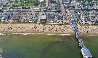 Aerial View of Busy Beach Boardwalk and Amusement Park
