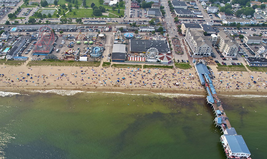 Aerial View of Busy Beach Boardwalk and Amusement Park