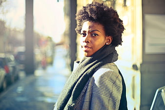 Confident Black Woman with Afro on City Street