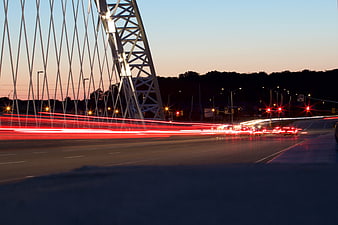Long Exposure Traffic Light Trails on Modern Cable-Stayed Bridge at Dusk